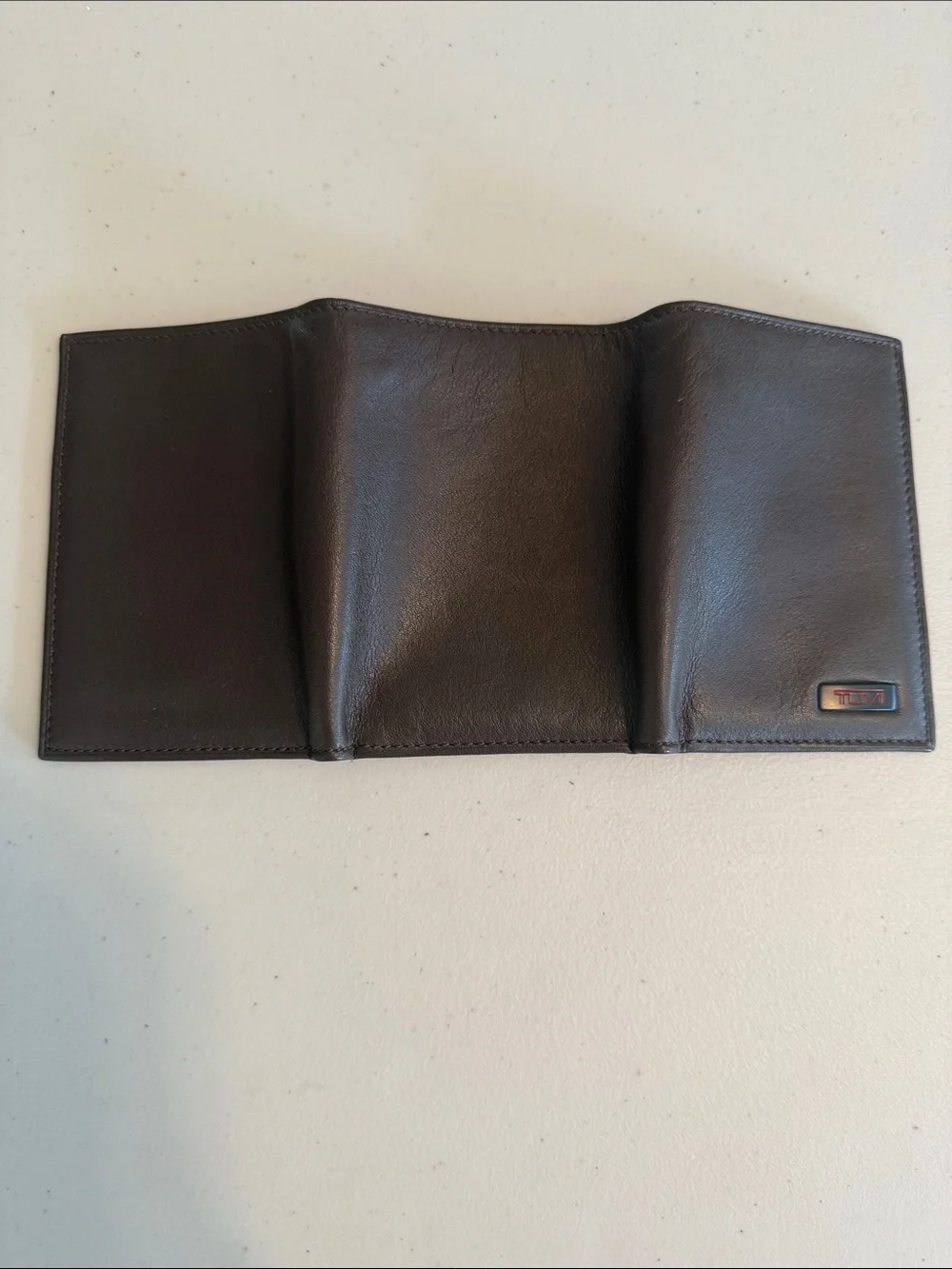 Tumi Brown Leather Tri-Fold Wallet with Red Logo Accent